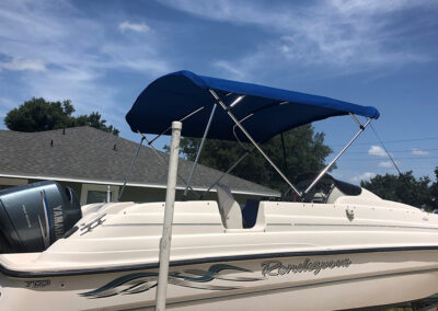 boat with blue custom canopy