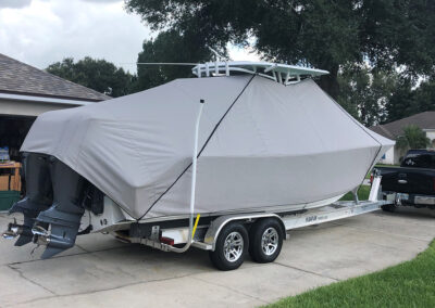 dual motor boat on trailer fully covered