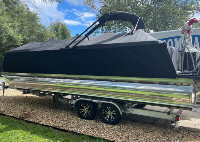 pontoon boat with cover on trailer