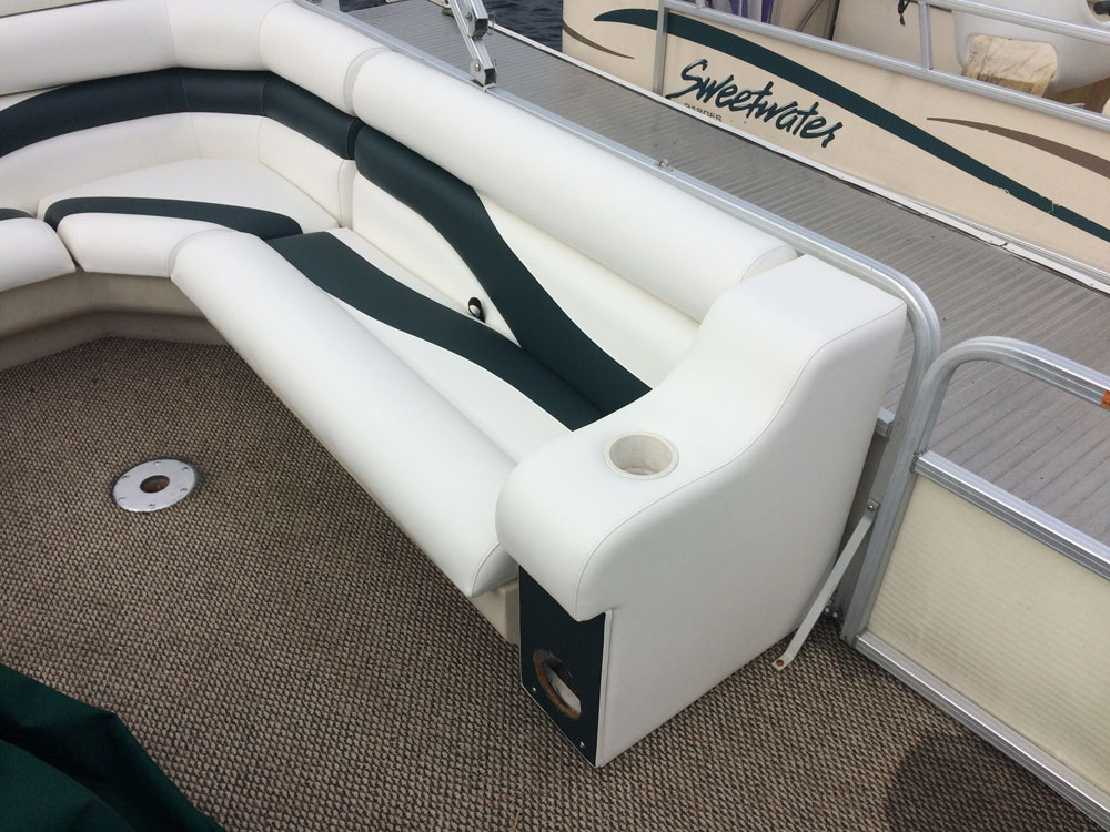 boat with custom teal canopy bimini top